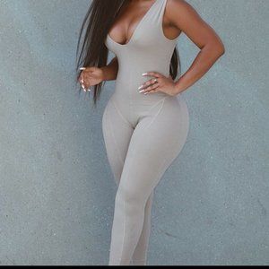 NUDE JUMPSUIT W/ FRONT SLITS SZ SMALL